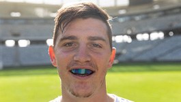 Man wears athletic mouthguard