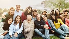 Dentures patient in Wakefield smiling with friends and family