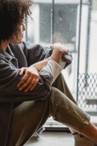 Woman sitting in a window